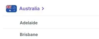 The expanded Australia row in Proton’s server list shows Adelaide and Brisbane at the start of its city list